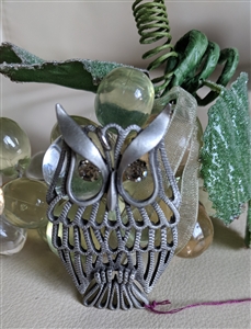 Vintage silver tone owl pendant with fixed white eyes and a drop dangle hanging style