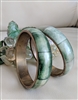 Vintage Mediterranean style set of two inlaid camel bone and brass bangle bracelets