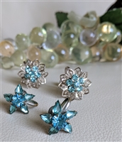 Vintage pre owned blue rhinestone screw back costume jewelry set featuring floral and star designs
