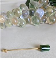 Vintage green stone hat pin with gold tone metal and rectangular stone showing light chip on back