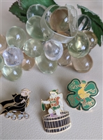 Set of three vintage metal enamel pins including a St Patricks Day duck a beer angel and a clergyman