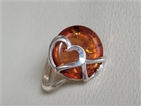 preowned vintage 1990s polish artisan sterling silver statement ring with multi-shade baltic amber center stone and double heart overlay