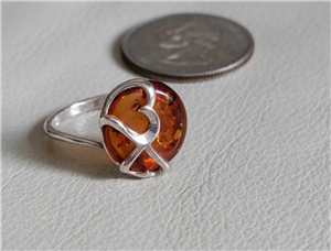 preowned vintage 1990s polish artisan sterling silver statement ring with multi-shade baltic amber center stone and double heart overlay