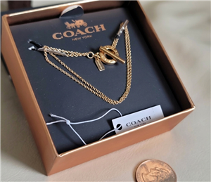 New old stock Coach gold tone open circle double strand toggle bracelet in box 2017