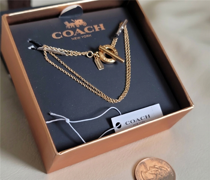 New old stock Coach gold tone open circle double strand toggle bracelet in box 2017