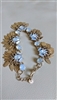 Halogen gold tone bracelet with movable tassel leaf bangles and opalescent centers