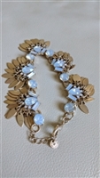 Halogen gold tone bracelet with movable tassel leaf bangles and opalescent centers