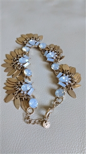 Halogen gold tone bracelet with movable tassel leaf bangles and opalescent centers