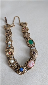 Goldette Victorian Revival style 11 charm sliding medallion bracelet in various design cameo style art jewelry