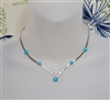 Sarah Coventry vintage silver tone metal choker necklace with blue beads and structured woven chain v style design