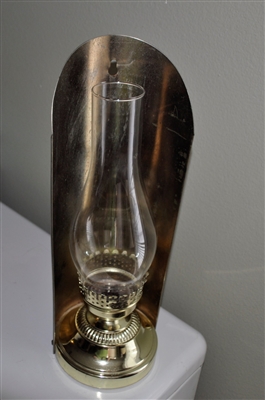 Preowned vintage brass candle holder in a kerosene lamp style suitable for wall decor or table display