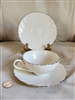 Lenox Weatherly cream porcelain teacup and two matching saucers with platinum rim trim 1959