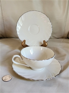 Lenox Weatherly cream porcelain teacup and two matching saucers with platinum rim trim 1959