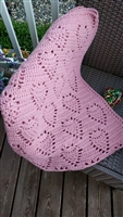Handmade vintage 1990s pink crocheted lap blanket with repeating heart pattern design
