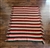 Vintage hand knitted reversible diagonal chevron zigzag pattern blanket in brown burgundy pink and white
