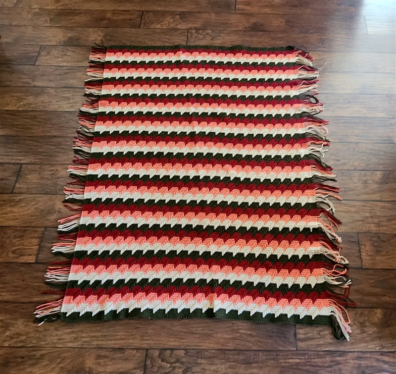 Vintage hand knitted reversible diagonal chevron zigzag pattern blanket in brown burgundy pink and white