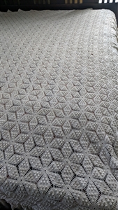 Vintage mid century American mill woven bedspread in a starlike geometric design with long fringes one hundred and six inches long