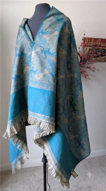 Handmade green and turquoise hue wool shawl wrap from India with grey color combination and fringe detail.