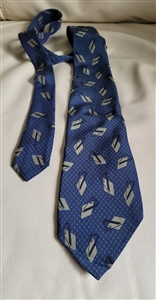 Elegant youthful men Silk Italian necktie ITALY designers collectible wear in geometric pattern over blue background