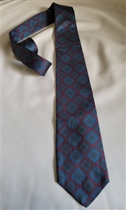 Geoffrey Beene silk tie in geometrical pattern blue black pattern over burgundy background
