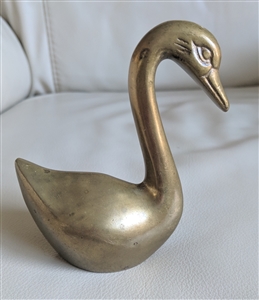 Elegant brass swan sculpture paperweight display