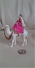 Vintage plastic celluloid Merchant on the camel collectible toy display.