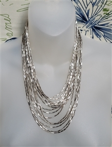 Silver tone 14 strand cascading liquid metal bead collar necklace with woven end caps