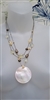 Multi strand beaded necklace with large round abalone shell pendant and leaf logo hangtag