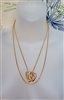 Vintage gold tone snake chain necklace with three interlocking openwork heart pendants