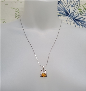 new old stock 1970s gemini zodiac pendant with genuine greenish-gold baltic amber cabochon and 21 inch sterling silver chain