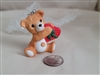 Cinnamon Bear 1988 Hallmark Keepsake ornament sitting bear with a heart shaped box collectible