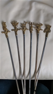 Beautiful vintage skewers set of 6 Brass tops Mythical Figurines Gods with metal ends.