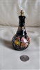 Vintage artisan-made black porcelain perfume dauber bottle with colorful Greek style decoration, measuring approximately 5 inches tall, featuring bottom lip gloss storage containing remaining product and vanity decor styling