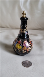 Vintage artisan-made black porcelain perfume dauber bottle with colorful Greek style decoration, measuring approximately 5 inches tall, featuring bottom lip gloss storage containing remaining product and vanity decor styling