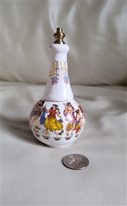 Vintage white porcelain perfume dauber bottle featuring multicolored Greek scenery, measuring approximately 5 inches tall, with bottom lip gloss storage containing remaining product and vanity decor styling