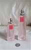 Preowned vintage pair of empty pink faceted Givenchy perfume bottles