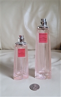 Preowned vintage pair of empty pink faceted Givenchy perfume bottles
