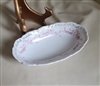 Vintage, oval porcelain relish server bowl made in Germany, floral interior with golden rim.