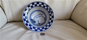Debbie Dean clay pottery round bowl with rabbit design and blue checkered rim