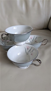 Castleton Porcelain Flair Pattern Pedestal Teacups Set of Four White and Gray with Platinum Color Rim and Floral Design Inside