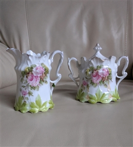 Antique Art Nouveau porcelain creamer and lidded sugar bowl set with pink roses and green leaves