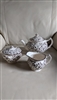 Johnson Brothers Susanna Brown three piece ironstone tea set featuring a teapot lidded sugar bowl and creamer with intricate brown floral transferware from the 1950s