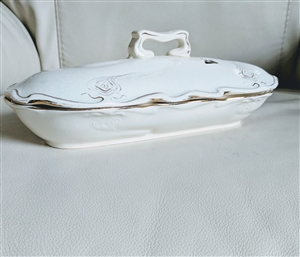 Antique Sarreguemines earthenware covered entree dish with steam vents and gold peacock design