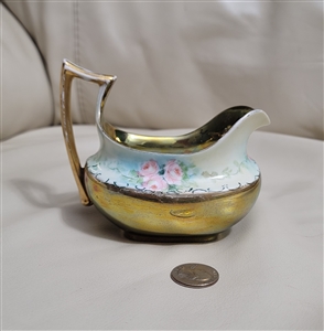 Favorite Bavaria C Hutschenreuther antique porcelain large creamer pitcher with heavy gold gilding and pink roses from the 1910s