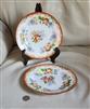 Japanese vintage porcelain plates in vivid floral design, se of two.