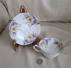 George Proctor Co Gladstone Iris teacup and saucer in colorful florals over white porcelain
