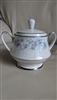 Noritake Splendor fine china two-handled lidded sugar bowl featuring blue and lilac floral spray band with platinum verge trim