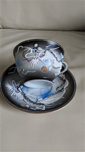 Japanese Moriage Dragonware teacup and saucer set with raised white dragon and Geisha lithophane cup bottom