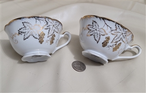 NAPCO porcelain set of two teacups gold embossed collectible vintage table setting kitchen accessories
