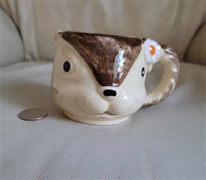 Vintage 1979 Enesco Japan ceramic squirrel mug with flower handle and yellow interior